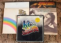 Front jackets of four of the five LPs