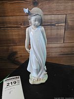 Front view of entire figurine showing height tag