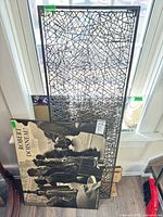 Front view showing metal vine panel and Doisneau print