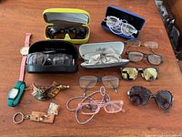 Overview of all eyewear, watches and accessories on table