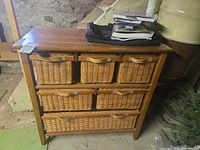 Front view showing all seven wicker drawers and wood frame