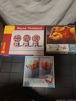 Three puzzle boxes front view
