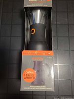 Boxed Asobu cold brew coffee maker showing carafe and filter through window