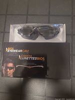 Boxed BIOS EyewearCam 1.0 showing sunglasses in clear window and outer sleeve
