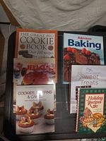 All six cookbooks arranged on tabletop