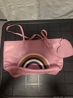 Front view of pink tote with rainbow applique and attached heart pouch