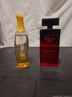 Both perfume bottles standing side by side