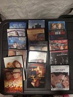 Front view showing 16 DVD cases laid out