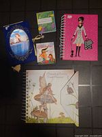 All five journals, planners and notebooks displayed on floor