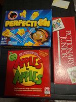Box tops of Perfection, Pictionary Junior, Apples to Apples