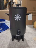 Full view of matte black Miracle Maid percolator with spigot and handles