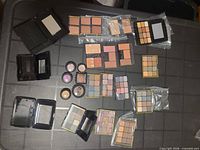 Overview of all palettes, singles and compacts laid on table