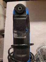 Close-up of tool front with plunge-cut blade attached