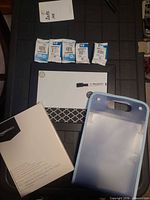 All items laid out: ink cartridges, dry erase board with marker/magnets, AmazonBasics labels, accordion file