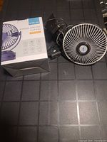 Boxed Opolar fan and generic fan side by side