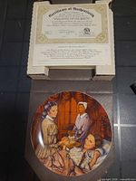Plate inside open box with certificate visible