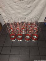 Group of Santa motif highball glasses showing design and quantity