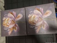 Front view of both floral canvases showing artwork and colors
