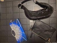 overview of all three bags: black sequin shoulder bag, blue rhinestone clutch, black wristlet