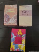 Front view of three sealed perfume boxes: Le Femme, 24x7 Sexy, Fantastic Bliss
