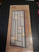 Box showing image of Simply Home Solutions black metal and frosted glass wall sconce