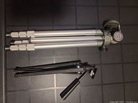 Both folded tripods showing overall construction and head type