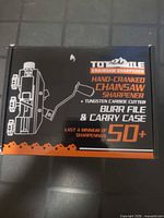 Front of TotTile chainsaw sharpener box showing product image and key features