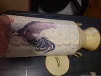 Full milk can showing rooster motif and lid