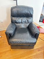 Front view of one black bonded leather recliner