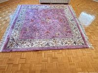 Full view of rectangular rug on parquet floor