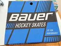 Bauer branded blue box top with Hockey Skates text
