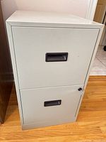 Full view of beige 2-drawer metal filing cabinet