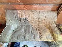 Full front view of sofa showing overall style, color and wear