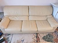 front view of beige leather 3-seat sofa