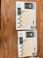 Two sealed boxes of LAVVIT LED 4.5W E12 bulbs, 12 units per box