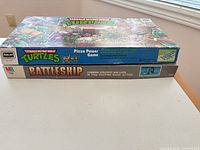 TMNT Pizza Power Game box stacked on Battleship box