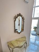 Mirror on wall above console showing overall size and style