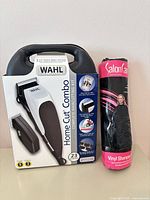 Boxed Wahl Home Cut Combo kit beside rolled SalonCare cape
