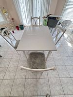 Top view of table with two chairs illustrating size, shape and color