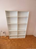 Front view of white 10-shelf bookcase