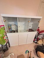 Front view of entire white wood and glass hutch buffet cabinet