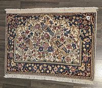 Full view of Kerman rug showing overall pattern, size perspective with fringes