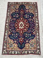 Full view of Tabriz rug showing overall design and size