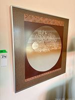 Oblique view of framed art showing frame material and overall appearance