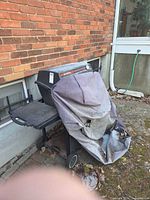 Full exterior view of grill with cover