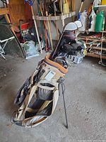 Stand bag with assorted clubs showing brands, shafts and grips