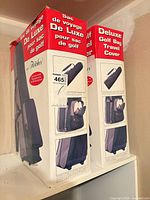 Two boxed Fletcher deluxe golf bag travel covers side by side