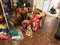 Group shot showing three twig reindeer, ceramic tree, angel figurine and boxed ornaments