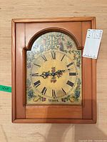 Front view of Silva wood wall clock showing dial and frame