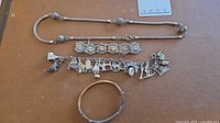 All four sterling silver jewellery pieces laid out